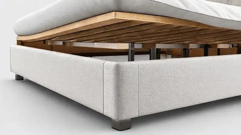 Ilustração detalhada de um corte transversal de uma cama box, mostrando a qualidade e densidade dos materiais estruturais internos.
