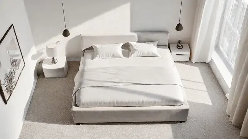 Vista superior de quarto contemporâneo com base box estofada, mostrando a integração elegante do design com o ambiente.