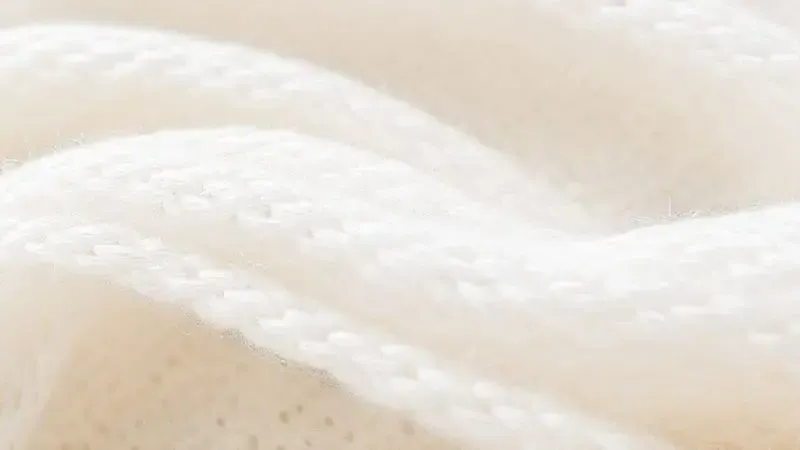 Ilustração 3D em macro de fibras entrelaçadas de tecido de algodão de alta qualidade.